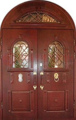 Стальная арочная дверь со стеклом и ковкой ДА-30 в дом из кирпича в Всеволожске