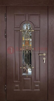 Темная железная дверь со стеклом и ковкой для частного дома ДСК-156 в Всеволожске