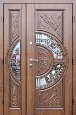 Уличная дверь в цвете Итальянский орех с виноритом и ковкой со стеклом ДВТ-147 в Всеволожске